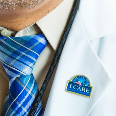 Doctor wearing 'ICARE' button
