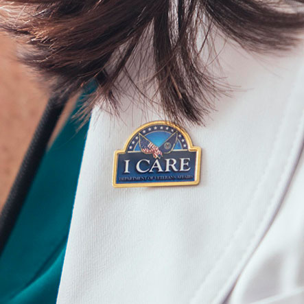 Doctor wearing 'ICARE' button